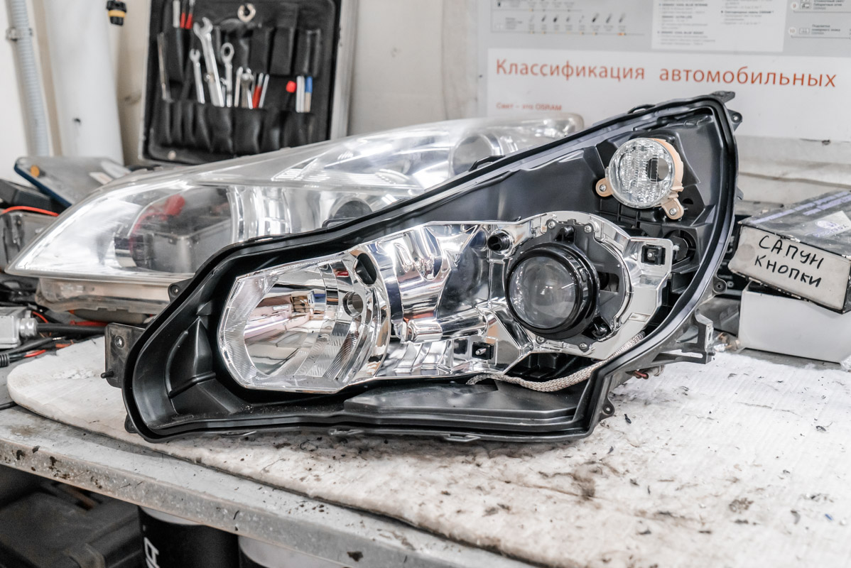 Снять фару на субару. Фара субару импреза 2004 gh. Крепление фары subaru outback 5. Снять фару на субару. Снять фару на субару.